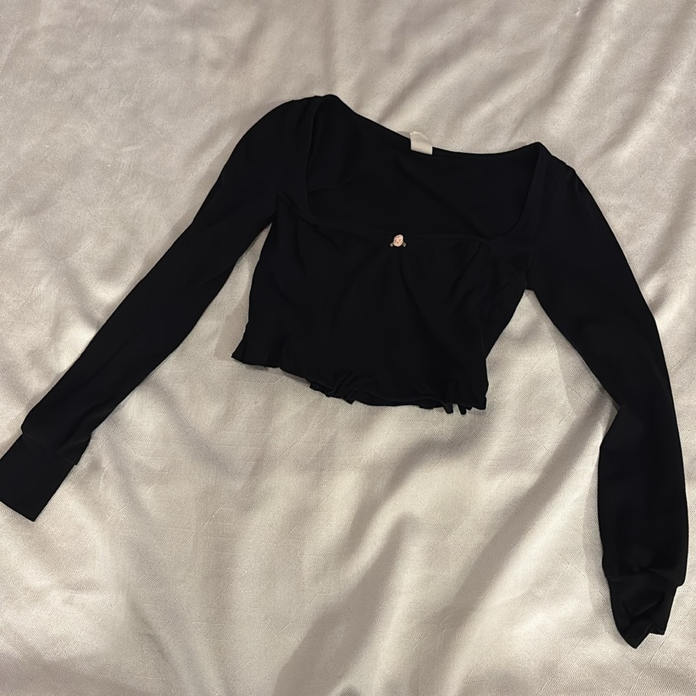 black long sleeve peplum top with rosette size xs